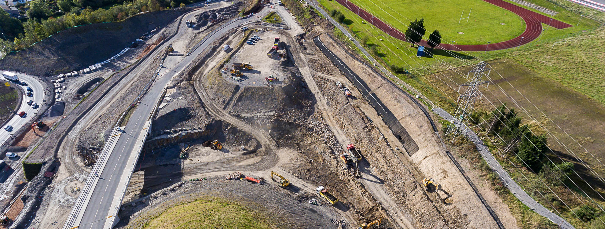 Aerial view of a construction site where a new road is being built.