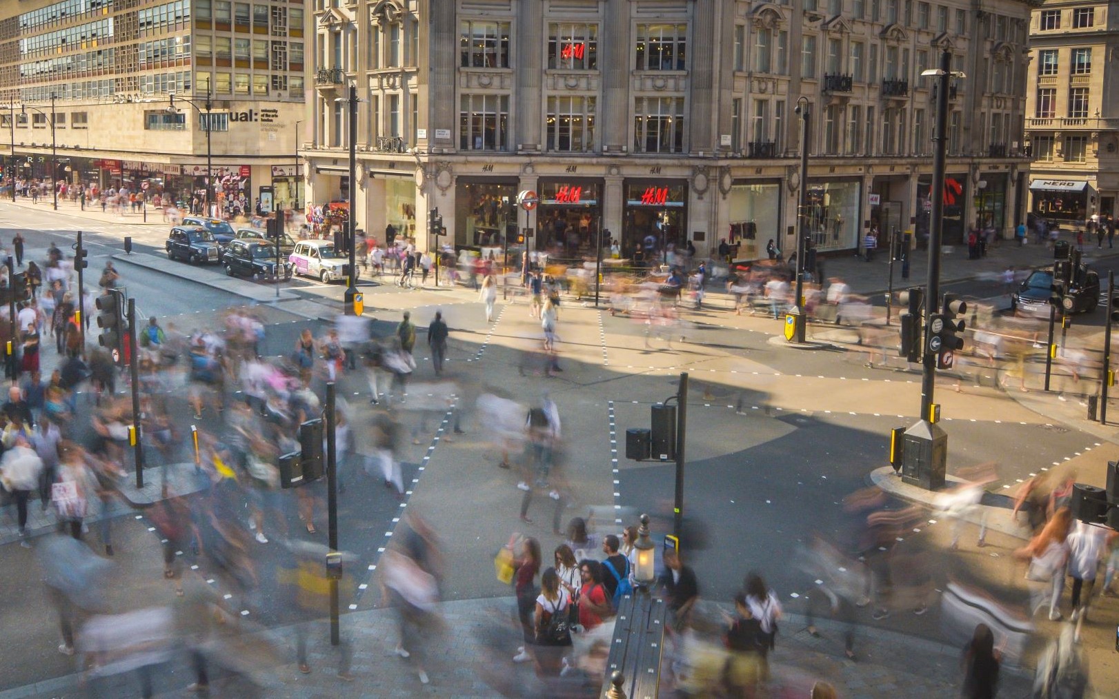 Oxford Circus Crossing on a busy day, with hundreds of people crossing the road.