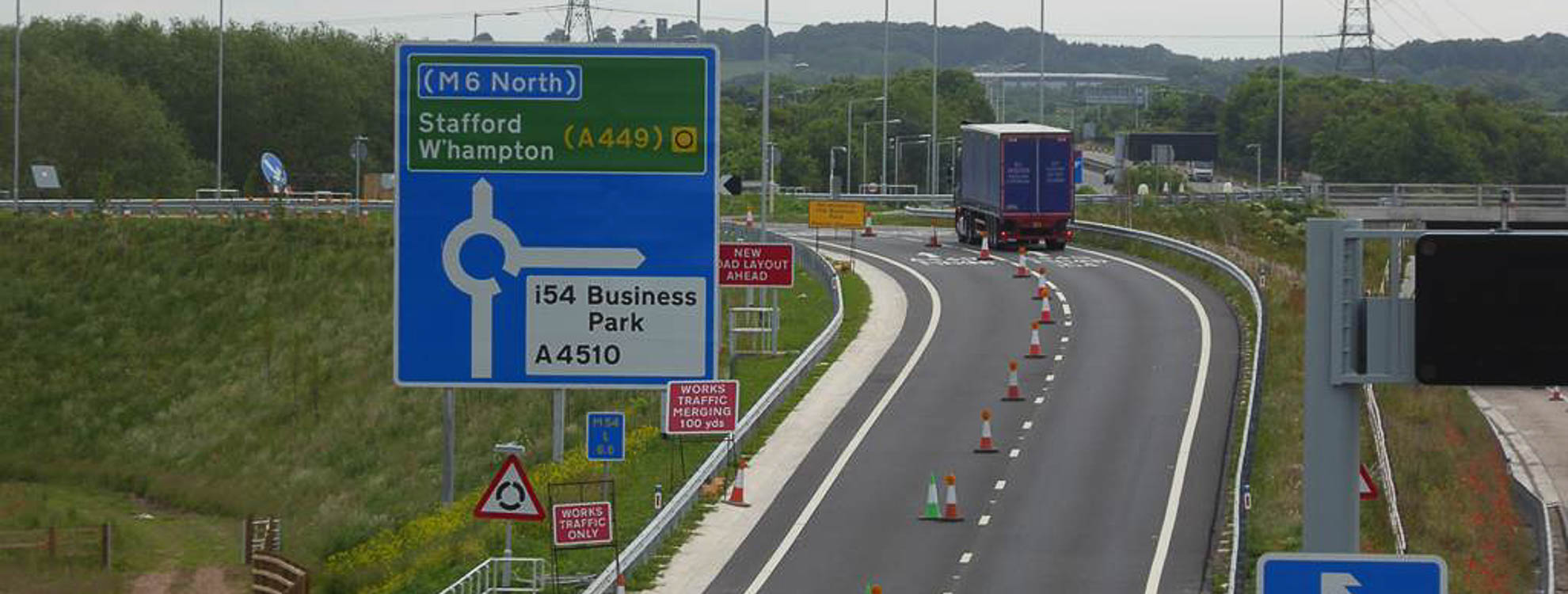 Temporary traffic management on a motorway where cones are being used to shut off one lane.